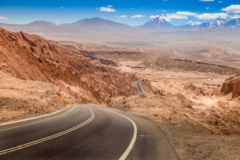 A road leading towards a mountain path.